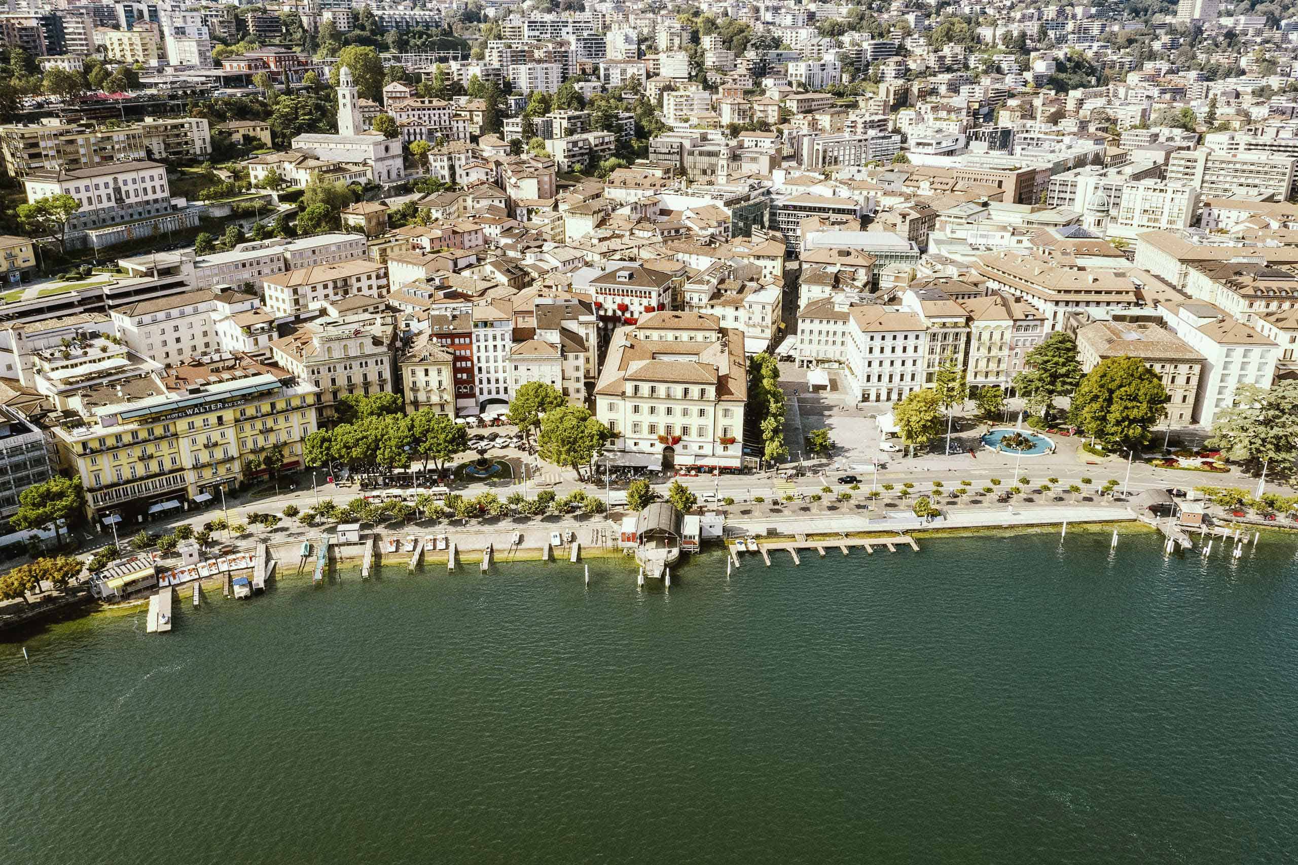 Swiss Deluxe Hotels Stories Summer 2020 5 Things To Do (Lugano) 01 Lugano Centro Vista Aerea, Lugano © Milo Zanecchia 2017 Ecirgb